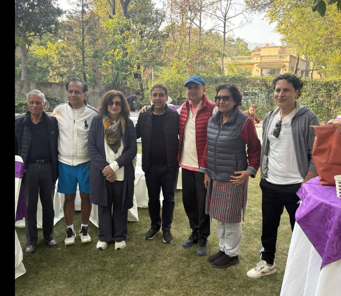 Club members posing together on the lawn after the tournament