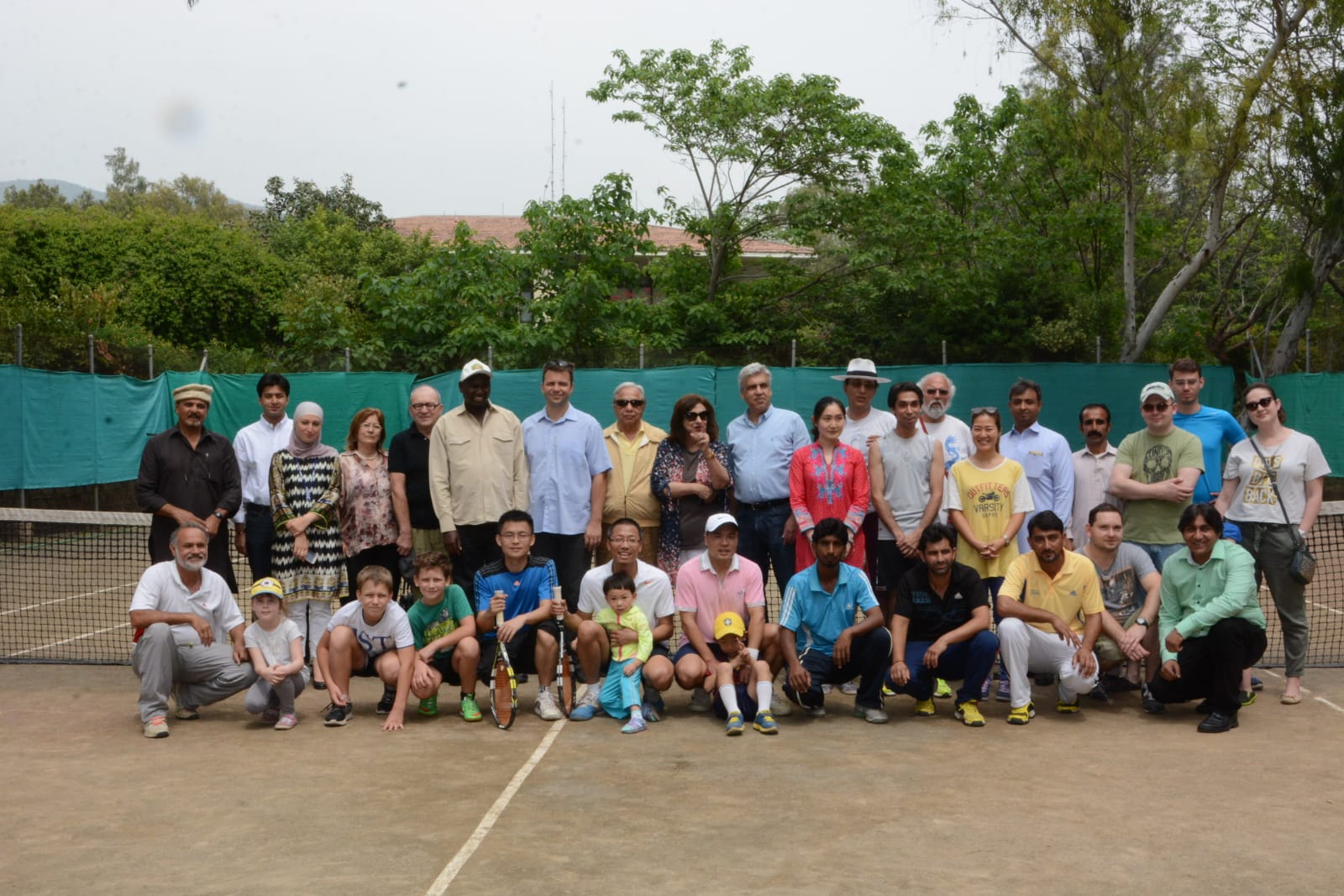 Members, families and diplomats gathered on court for the Margalla Tennis Club group photograph